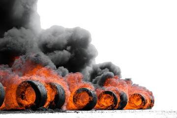 Row of burning tires emitting thick black smoke against a white background