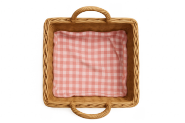 Wicker picnic basket with pink gingham cloth isolated