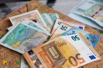 Bulgarian Leva and Euro banknotes are displayed together, representing the country's economic shift and the upcoming adoption of the Euro as its official currency.
