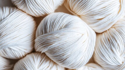 White yarn balls close-up texture in soft natural light