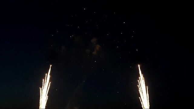 Striking golden firework rocket soars through the night sky in celebration