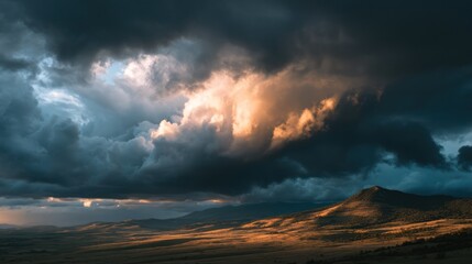 Stormy clouds gather over a sunlit mountain landscape