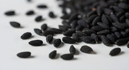 Fresh black pepper seeds and black olives on a wood table a spice and fruit ingredient closeup