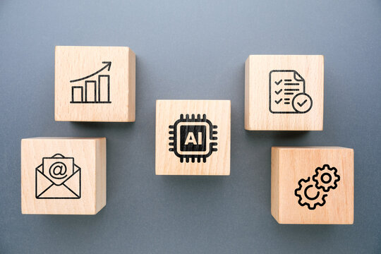 Artificial intelligence performing multiple tasks shown through wooden blocks with icons including chart, checklist, gears, email and processor