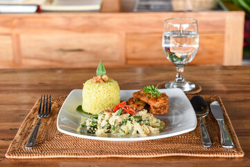 Urap sayur is a popular Indonesian side dish/salad combining blanched vegetables with a spiced coconut topping