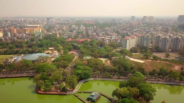  Futuristic aerial view panorama of developing Yangon city , Aerial view of Sule pagoda in downtown, Yangon, Myanmar. Sule Pagoda located in the heart of Yangon, Karaweik royal barge, Kandawgyi Lake, 