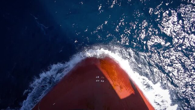 Bulbous Bow of a Cargo Ship Cutting Through Ocean Waves , Maritime Transportation