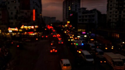 Night city traffic with cars and bright lights on the busy urban streets