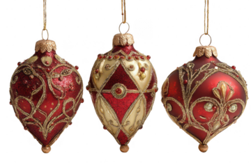 Three ornate vintage christmas ornaments in red and gold hanging against a transparent background
