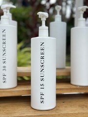 shampoo and soap sunscreen in a pump bottle 