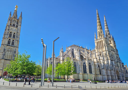 Bordeaux, France - May 10, 2024: the majestic Saint-Andre Cathedral and its separate Pey Berland Tower. French Gothic architecture in the modern square with multiple tourists