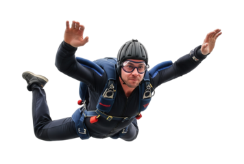 Skydiver in a dark suit with arms and legs outstretched during freefall.Isolated transparent background ( cut-out PNG file ).