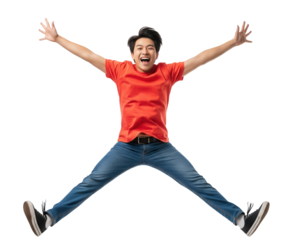 Excited young man in a red t-shirt jumping with arms and legs spread in a star shape. Isolated transparent background ( cut-out PNG file ).