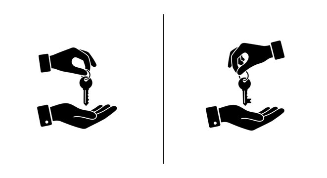 Two hands exchanging keys symbolizing transfer or transaction of ownership