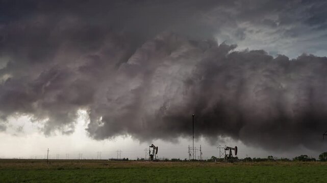 Natures power displayed in dark storm cloud textures across open fields 