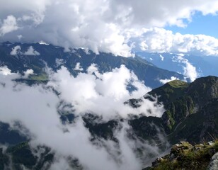 Mountain peaks shrouded in clouds