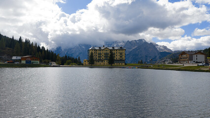 Fototapeta premium Lake Misurina and the asthma center, picturesque view of a mountain in the Italian dolomites.
