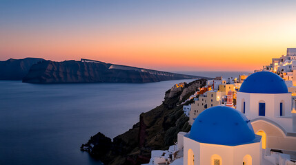 Picturesque coastal village under vibrant sunset. White buildings with blue domes overlook the tranquil sea, creating a serene and idyllic scene.