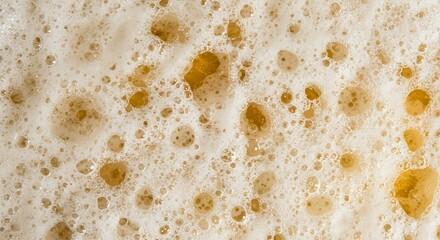 Refreshing bubbly beer foam background texture for summer vibes and beverage promotions, perfect for bars, breweries, and restaurants seeking a vibrant backdrop