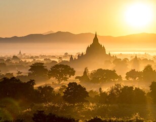 Sunrise over ancient temples shrouded in mist