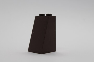 Obraz premium Black Lego brick piece isolated on a white background 
