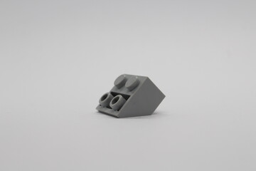 Obraz premium Grey Lego brick piece isolated on a white background 