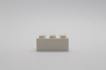 Obraz premium White Lego brick piece isolated on a white background 