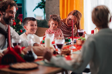 Family enjoying christmas dinner together at home