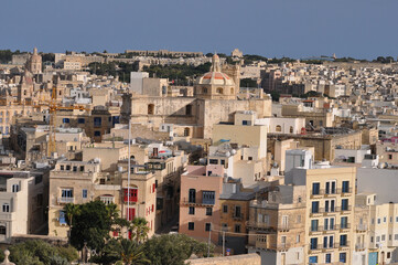 Fototapeta premium View of old building with windows, balconies in city. Republic of Malta, the picturesque city of Valetta, Malta.