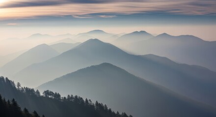 Fototapeta premium Layered misty mountains at sunset. Fog-shrouded peaks with colorful gradient sky. Serene atmospheric landscape evoking tranquility and nature's depth