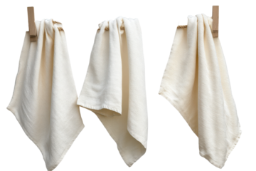 Natural fabric towels drying on a rope in a bright outdoor setting under clear blue skies during a sunny day