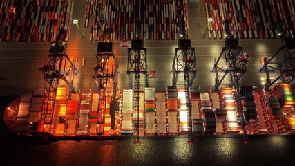 Huge shipping yard at night for worldwide container transport - Powered by Adobe