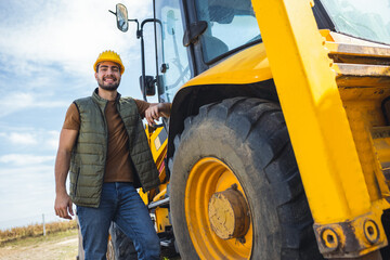 Excavator operator leaning on excavator