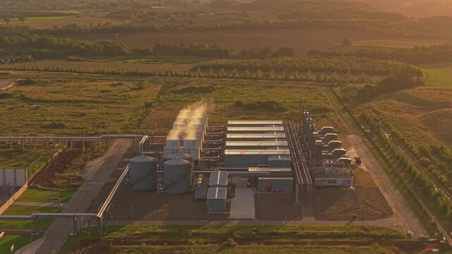 Google data hub at dusk, drone aerial shot in warm sunset light