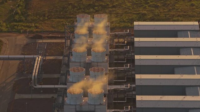 Drone flyover of Google data campus glowing at golden hour