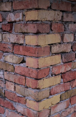 Fototapeta premium corner of a brick wall, ancient brick