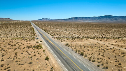 Aerial Nevada Desert Highway Vast Open Landscape and Distant Mountains