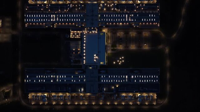 Modern IT hub glowing after dark in Odense, Denmark.