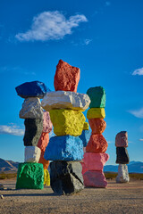 Colorful Rock Stacks at Seven Magic Mountains in Nevada Desert Under Blue Sky