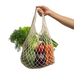 Fototapeta premium Hand holding reusable net bag filled with fresh vegetables isolated on a transparent background