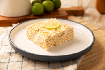 Carlota de Limon, a cold, no-bake dessert made with layers of Maria cookies and a creamy mixture of lemon and condensed milk, an easy homemade recipe very popular in Mexico.