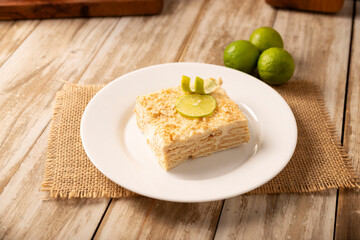 Carlota de Limon, a cold, no-bake dessert made with layers of Maria cookies and a creamy mixture of lemon and condensed milk, an easy homemade recipe very popular in Mexico.