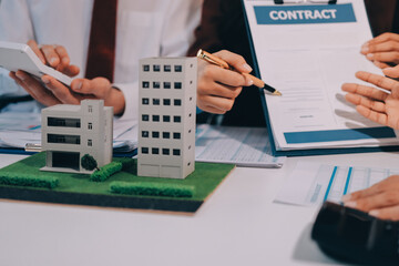 Real estate agent and customer signing contract to buy house, insurance or loan real estate.rent a...