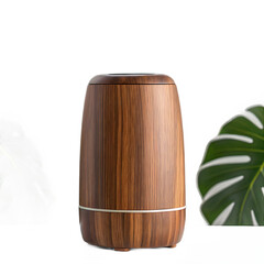 A close up of a wooden humidifier with monstera leaves on a black background in a studio setting