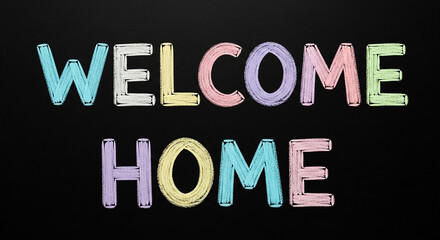 Welcome home text written with colorful chalk on a black chalkboard, conveying a warm and inviting message for a new beginning