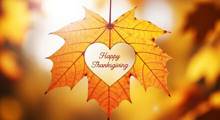 A single autumn maple leaf with a heartshaped cutout revealing happy thanksgiving text, symbolizing gratitude and fall
