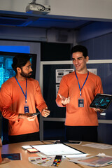 Software developer or creative designer presents UX, UI development design to team. Man explains...