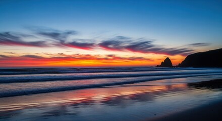 Vibrant sunset over the ocean with colorful clouds and reflections