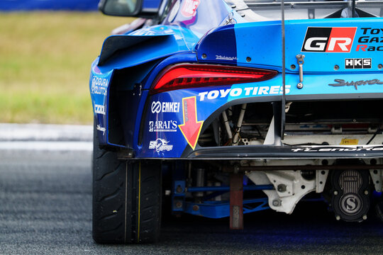 Latvia, Riga 03-05.10.2025. FIA Drifting cup,  a blue Toyota GT86 race car driving on a race track, with text on the car and grass in the background