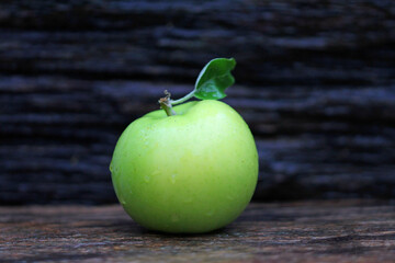 green apple on wooden background